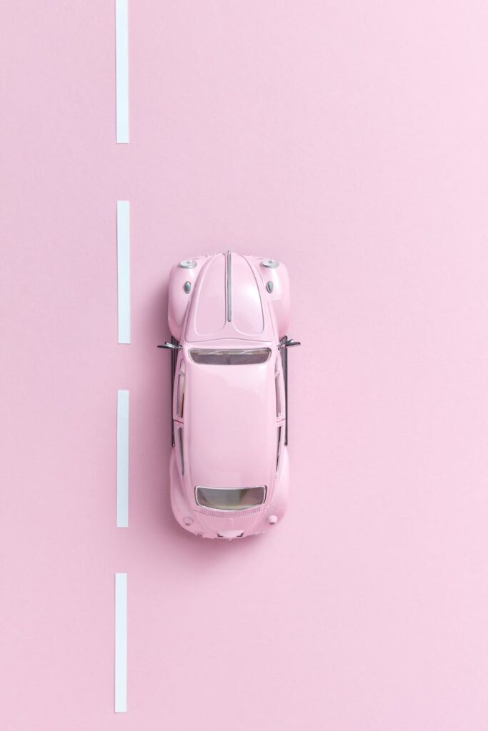 overhead shot of a pink car toy